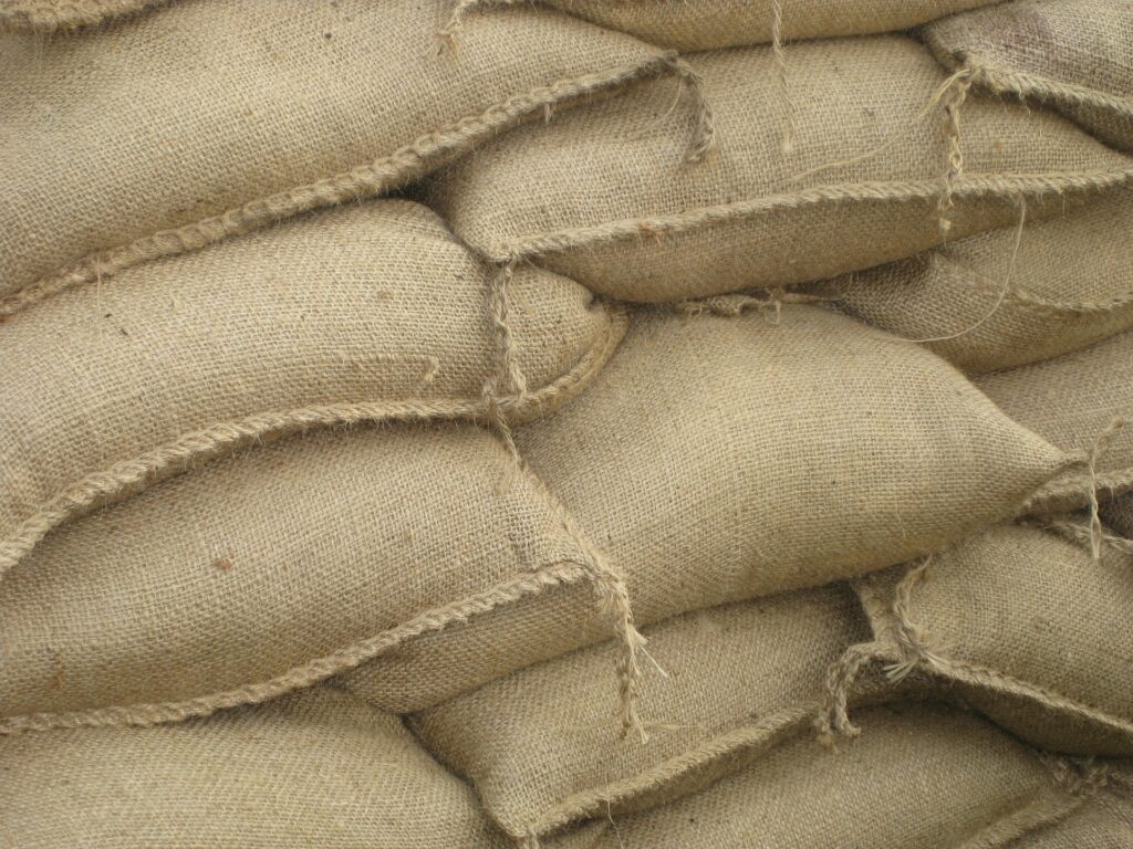 Grain filled Jute Bags stored in Warehouses